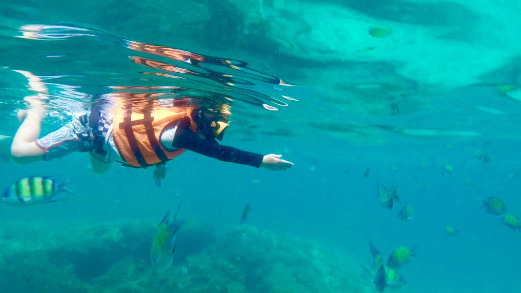 Justice decked out in his snorkel gear chasing the fish!