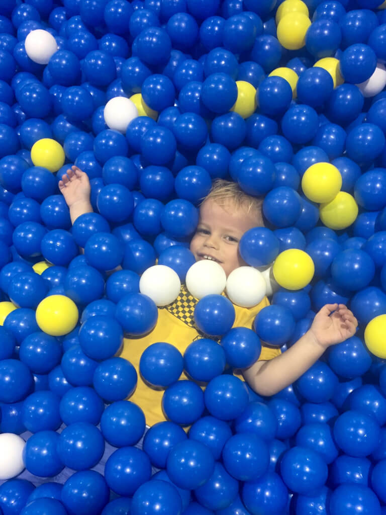 I spy a baby in a ball pit!