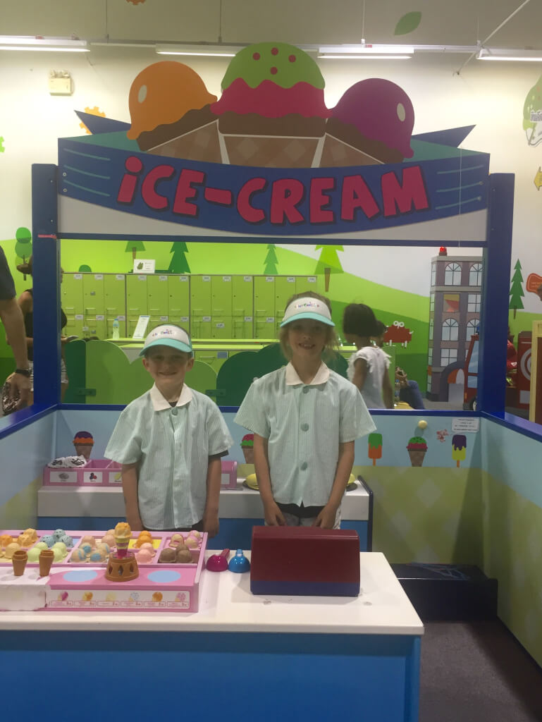 The kids dressed up and running an ice cream store!