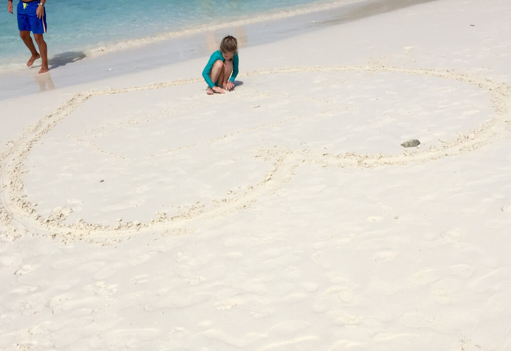 Liberty drawing pictures in the sand!